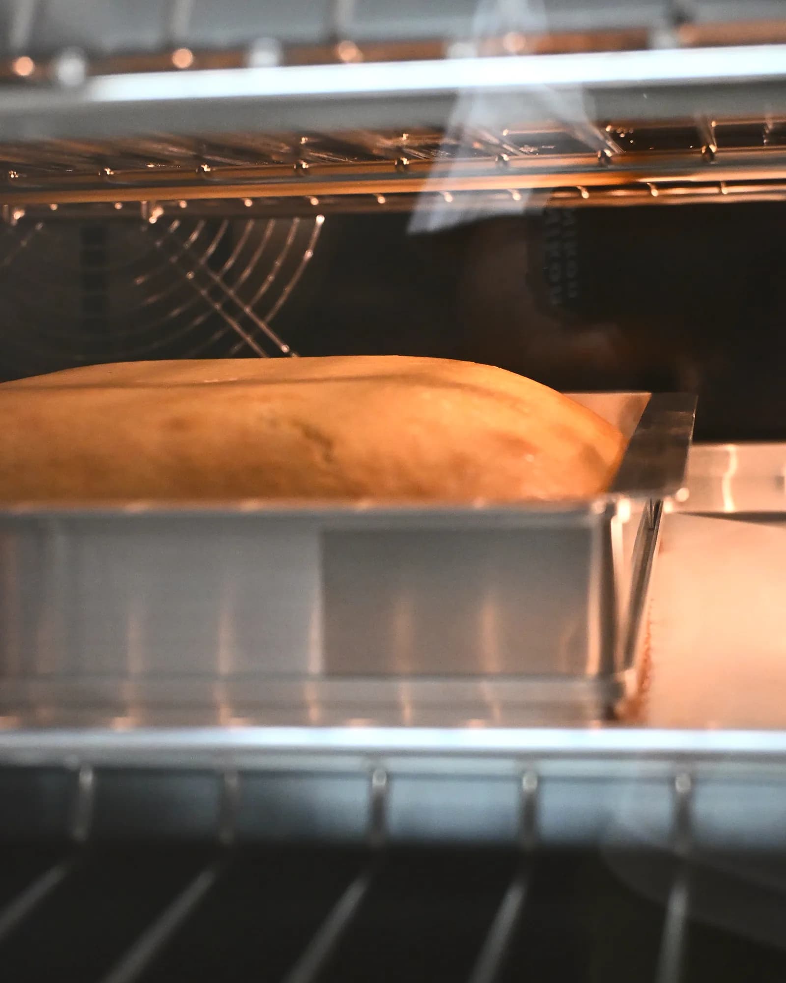 A sponge baking in the café's oven, the base every mousse cake is built on